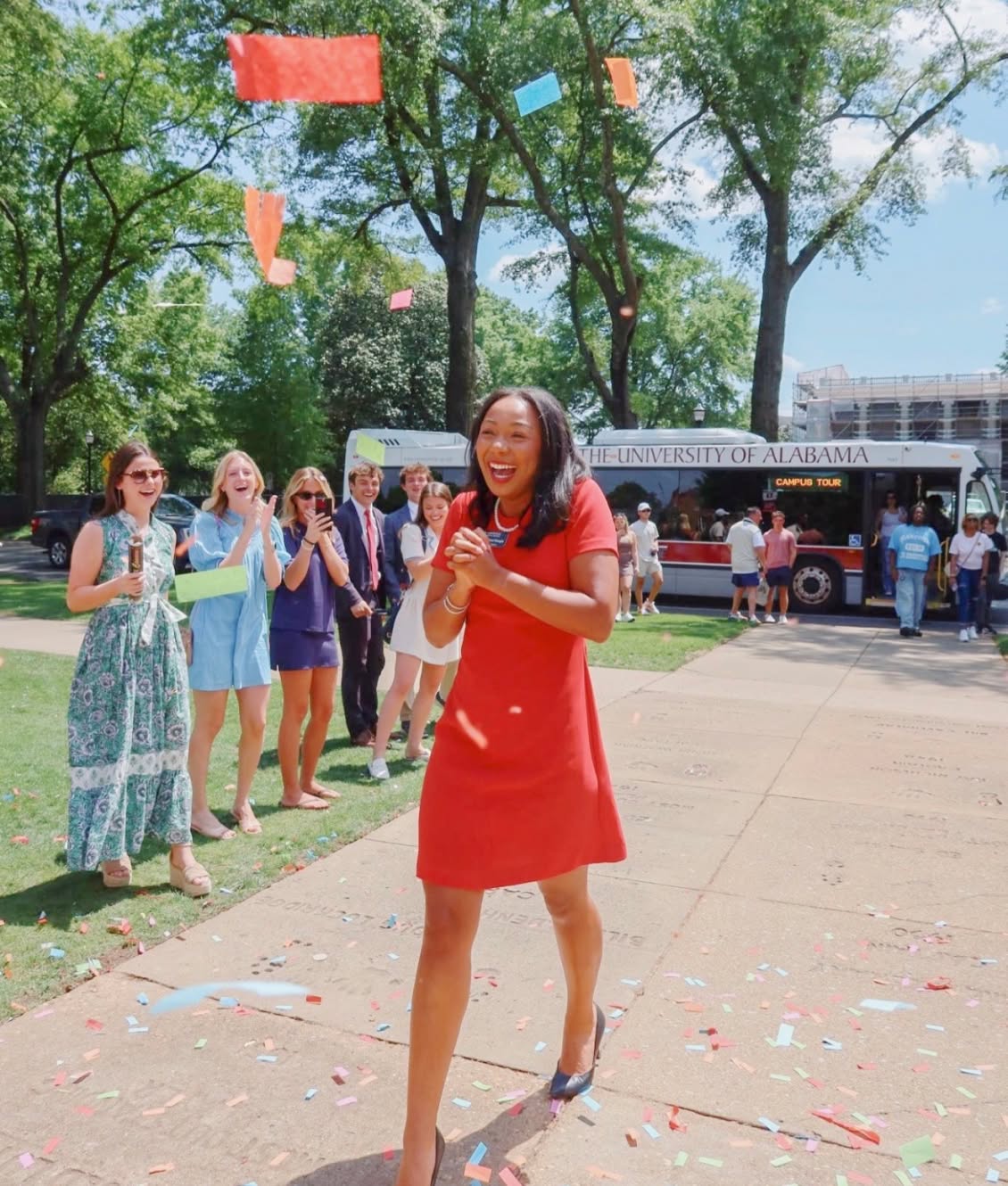 PMU sister smiling and cheering at a campus event