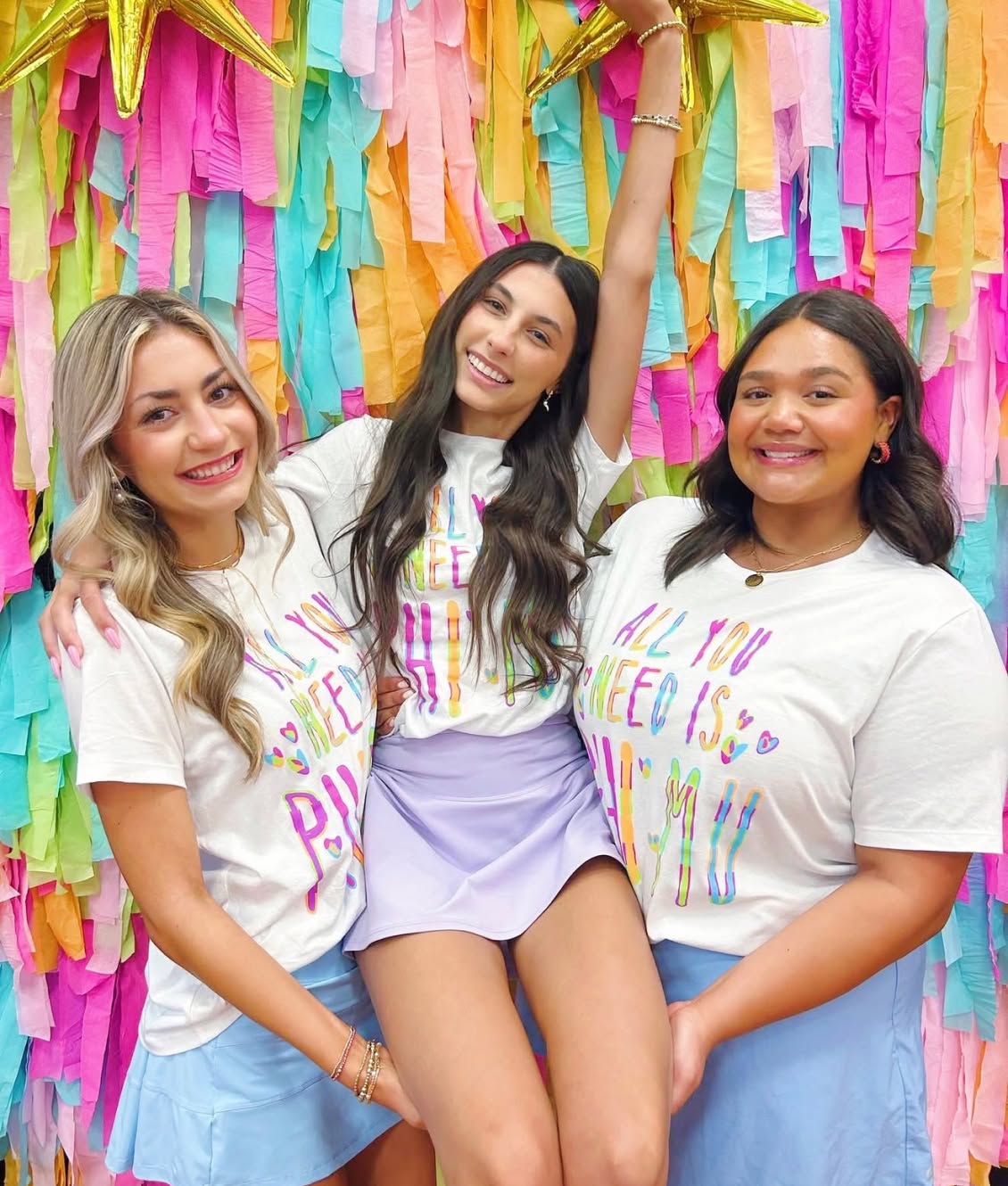 PMU-sisters-posing-for-photo-joining-phi-mu@2x