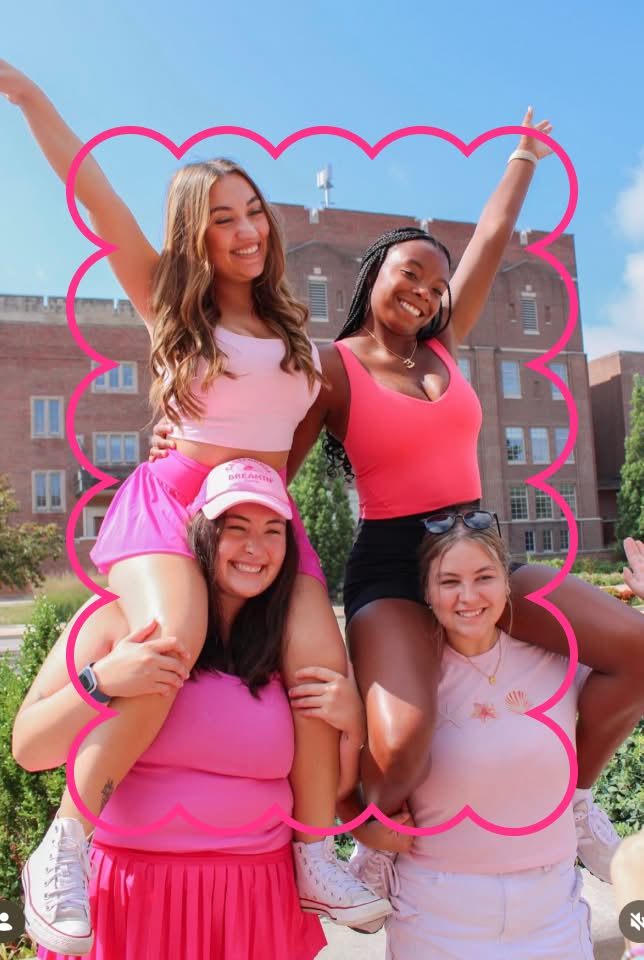 PMU sisters smiling together at a campus event with a scallop outline overlaying
