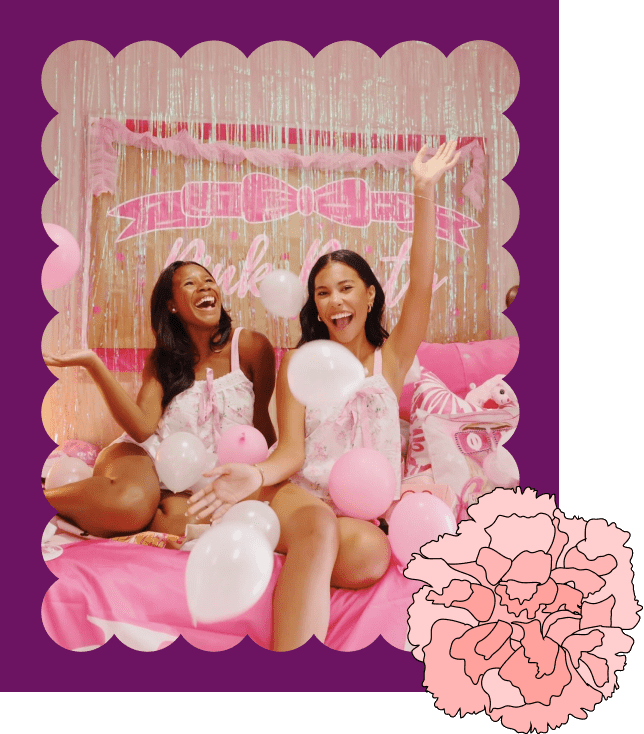 photo of sisters in a ballon filled room laughing having fun in a scallop cut out frame with a carnation decoration