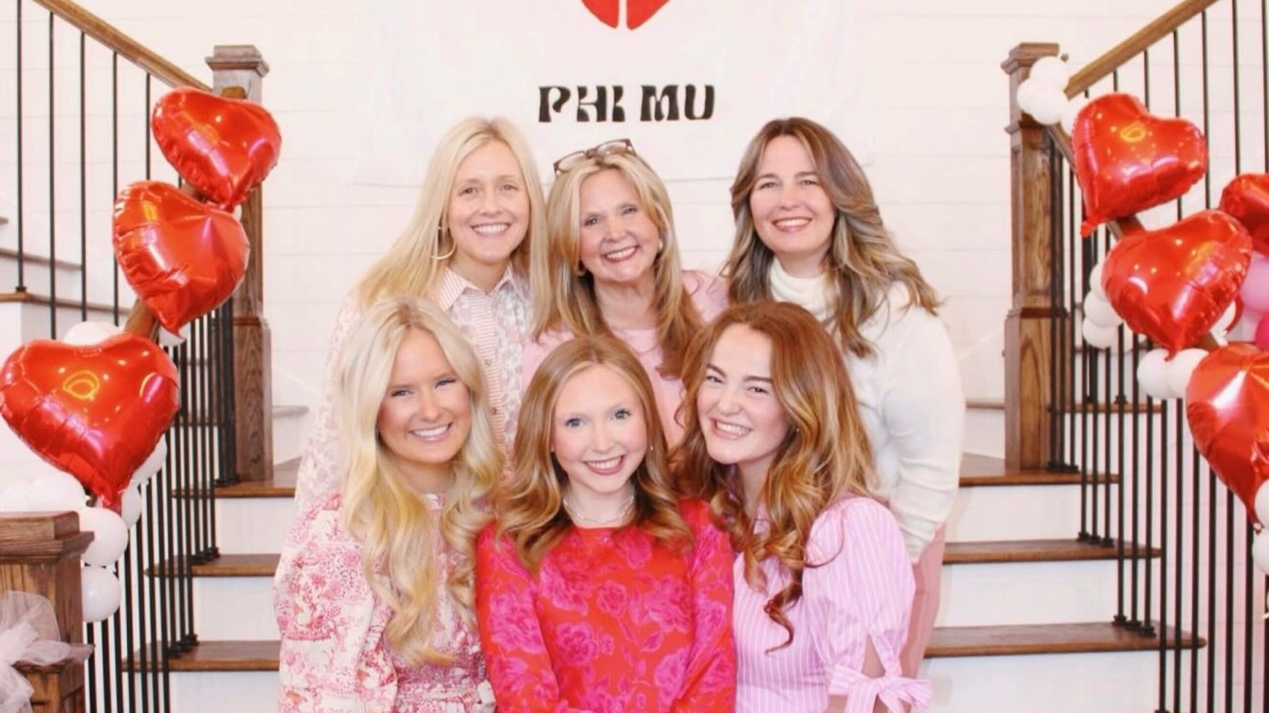 PMU sisters standing with family during a campus event