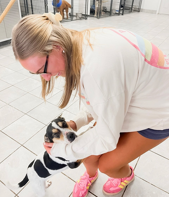 PMU member at dog shelter volunteering