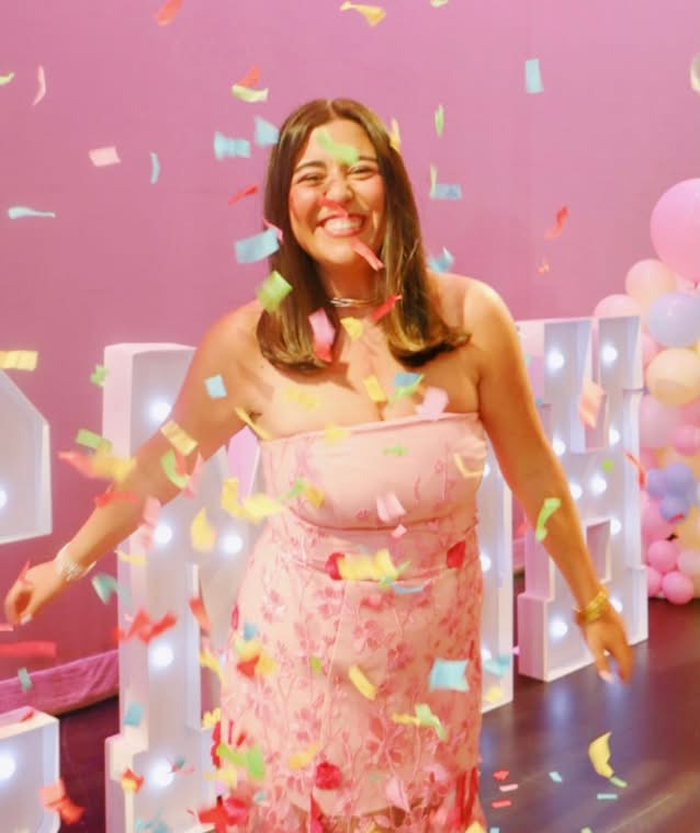 PMU-sister-smiling-for-photo-with-confetti-photo-programs-and-leadership-small@2x