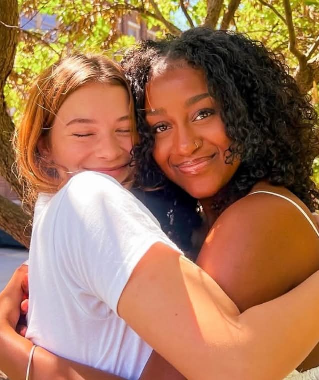 PMU-sisters-hugging-for-picture-about-phi-mu-small@2x